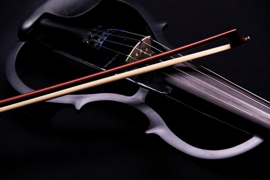electronic violin on a black background