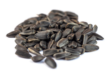 Sunflower seeds isolated on white background, close up