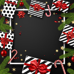 Fototapeta premium Christmas and New Year card with fir branches, gifts, candy and confetti. Top view card.