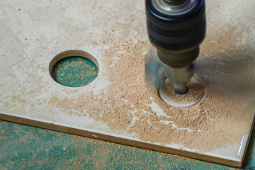 Tools for construction work. Tile cutter in work