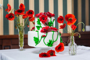Wedding cake decorated with poppy flowers