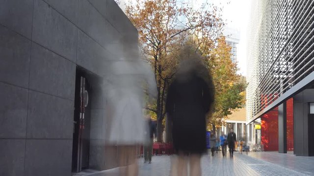 Time lapse. A busy walkway near office buildings. London in autumn.