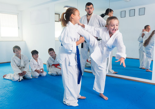 Girls training during karate class