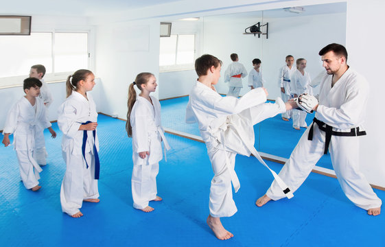 Positive children practicing karate moves