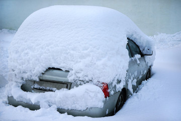Car covered with much snow.