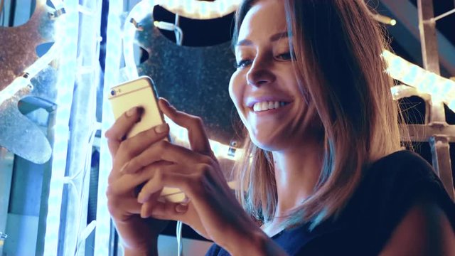 attractive woman is surprised at what he saw in the phone