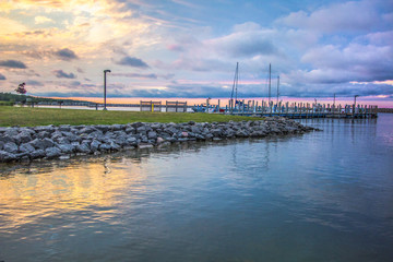 Summer Lake Sunset Background. Harbor and boats in a marina during a beautiful summer sunset on the coast of Lake Huron.