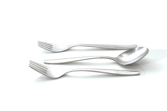 Set of two forks and a spoon on a white background