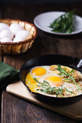 Countryside breakfast roasted eggs with bacon rustic food