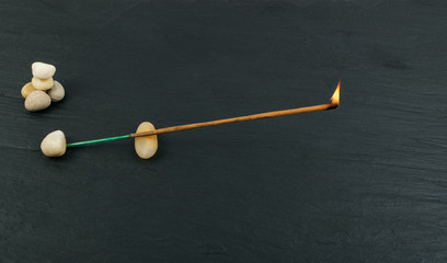 Burning incense aroma sticks with smoke on black background