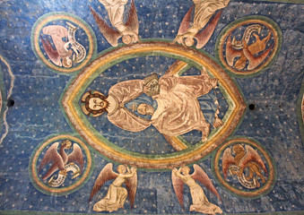 Fototapeta na wymiar Cristo in gloria con i simboli degli evangelisti; affesco nella chiesa romanica di San Giovanni in Villa a Bolzano
