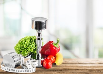 Dumbbells with bottled water , measuring tape