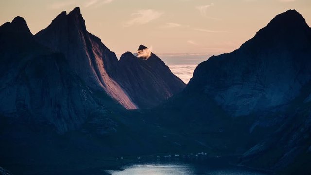 Establishing shot of the Bunesfjorden with the midnight sunlight, Lofoten islands, Norway.