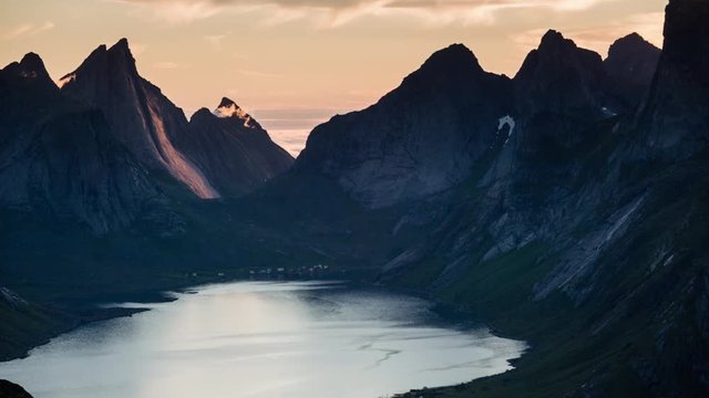 Establishing shot of the Bunesfjorden with the midnight sunlight, Lofoten islands, Norway.