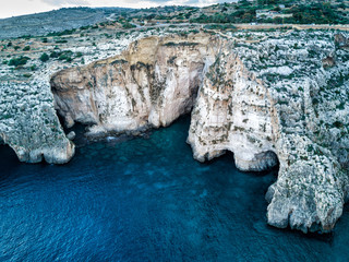 Aerial drone photograph of the cliffs & rugged coast of the island country of Malta.  Mediterranean...