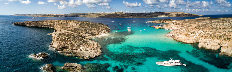 Aerial drone photo - The famous Blue Lagoon in the Mediterranean Sea.  Comino Island, Malta.     