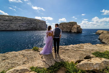 Wedding photography - Couple getting married on the rugged Maltese coastline.  Island of Gozo, Malta.  