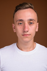 Fototapeta premium Face of young handsome man with blond hair