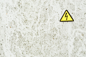 Texture of white iron metal rusty shabby painted paint spit wall and yellow warning triangular...