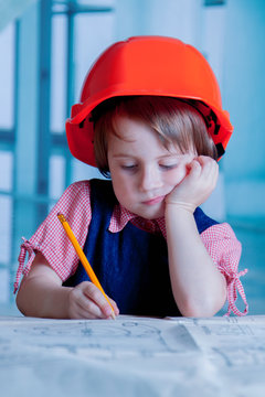 Humorous photo of female industrial engineer working in design bureau. Work and business concept.