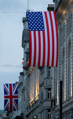UK and US flag in London at Piccadilly Circus