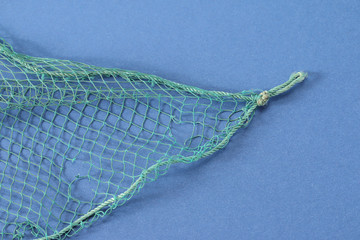 Fishing net with space for your text. Background for a fishery theme. 