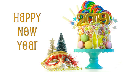 Happy New Year's candy land lollipop drip cake with 2019 candles on white background with text greeting.