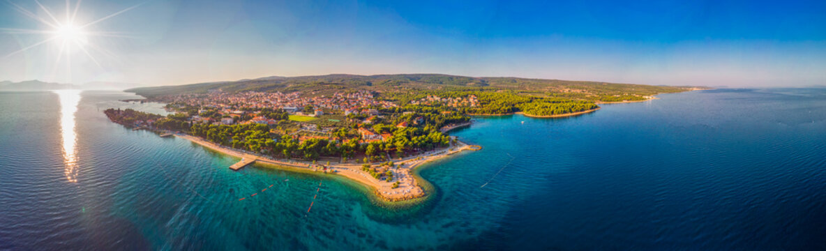 Aerial view of seaside promenade in Supetar town on Brac island with palm trees and turquoise clear ocean water, Supetar, Brac, Croatia, Europe