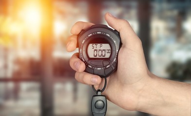 Fototapeta premium Man hand holding stopwatch