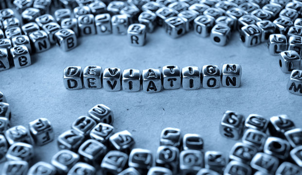 Deviation - Word from Metal Blocks on Paper - Concept Photo on Table
