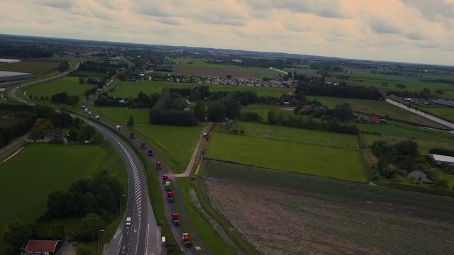 Truck parade with lots of trucks and trailers. Many transport companies participate in this parade.