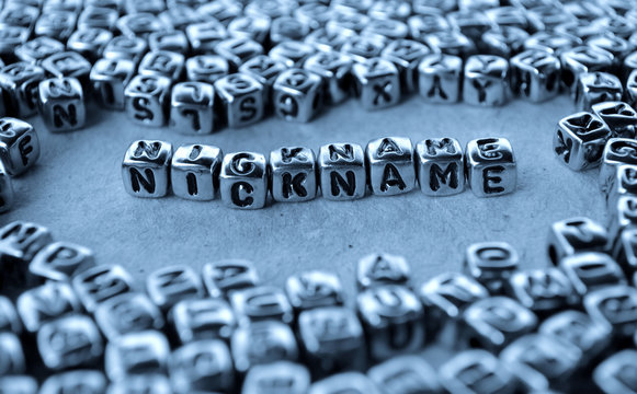 Nickname - Word from Metal Blocks on Paper - Concept Photo on Table
