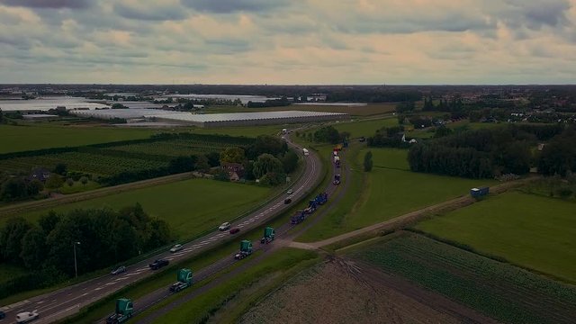 Truck parade with lots of trucks and trailers. Many transport companies participate in this parade.