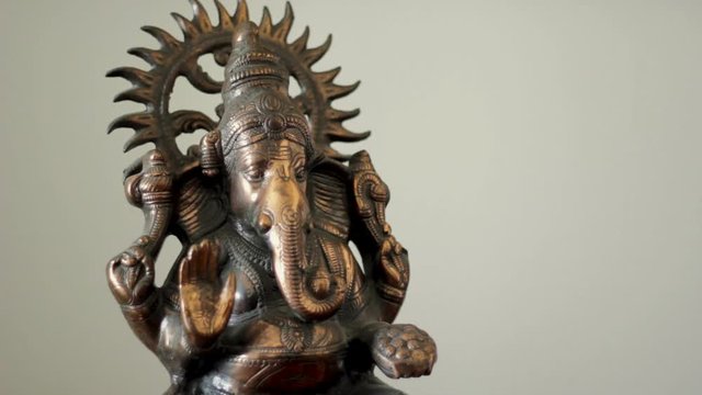 Lord Ganesha statue on white background