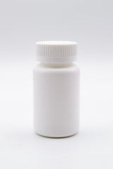 Blank empty white medicine bottle isolated on white background