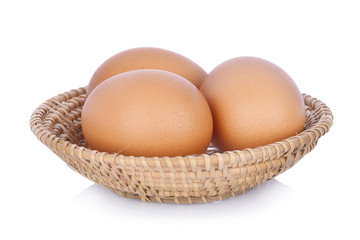 eggs in basket on white background