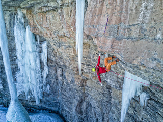 Skilled ice/mixed climber on the rock walls of the East Vail Amphitheater