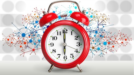 Retro alarm clock on blurred background