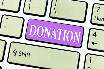 Conceptual hand writing showing Donation. Business photo showcasing something that is given to...