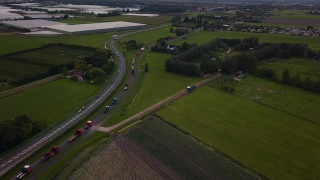 Truck parade with lots of trucks and trailers. Many transport companies participate in this parade.