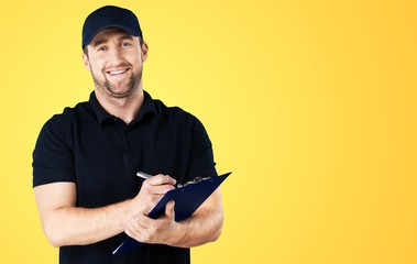 Delivery man with clipboard on light background