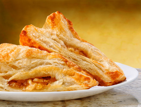 Apple Turnovers on a plate and granite counter top