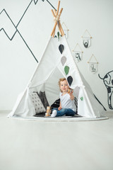 A large wigwam baby is played, in a bright room, for a birthday, a holiday © Anton