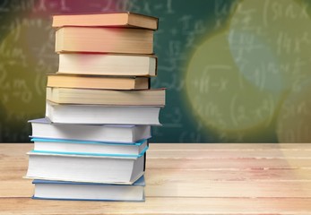 Books and glasses on  table  background,close up