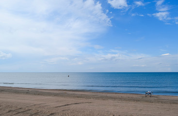Fototapeta na wymiar Deserted sea beach. Quiet sea Sea surface landscape.