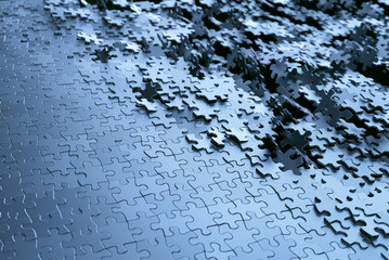 Jigsaw puzzle background. Image of puzzle pieces in chrome gray metal.