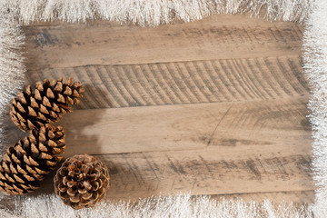 Obraz premium christmas background with snow and holy tree branchon wooden background