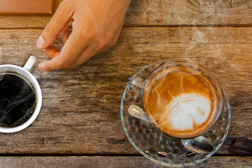 Coffee background, top view with copy space. background, cup of coffee and a smoke good morning,  Hot coffee and spoon, Selective focus. Cup of coffee on table in cafe, 
