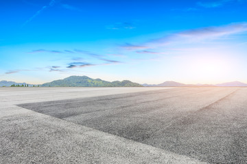 Wide asphalt square and beautiful mountain scenery