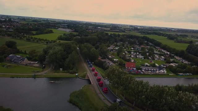 Truck parade with lots of trucks and trailers. Many transport companies participate in this parade.